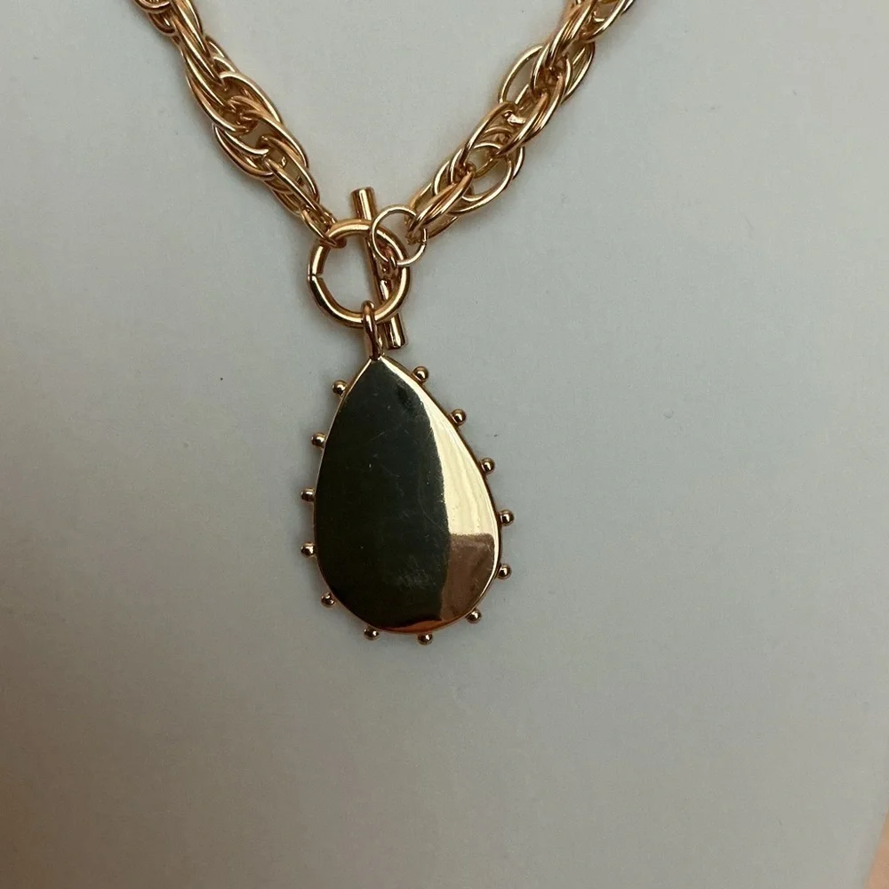 Brown Teardrop Gold Tone Pendant this necklace